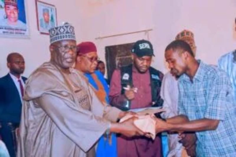 Yobe State government officials presenting relief donation to boat accident victims and their families in Nigeria
