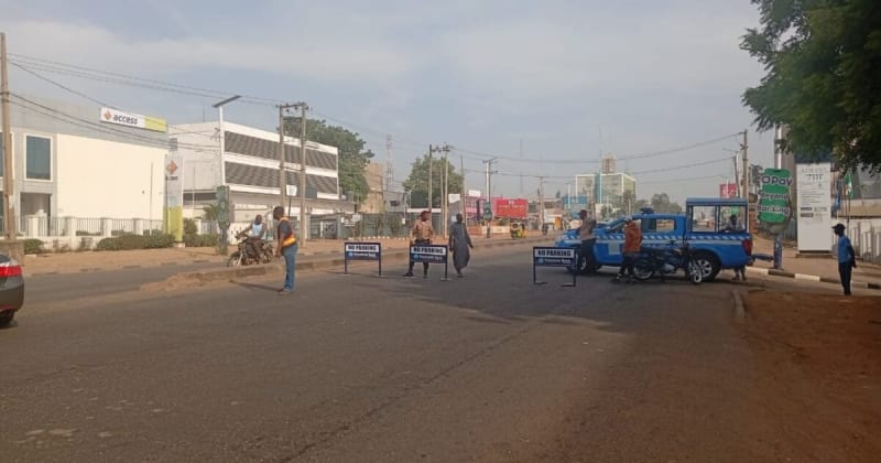 Emergency responders securing overturned fuel tanker at busy Kaduna intersection to prevent explosion
