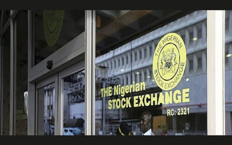 Nigerian Stock Exchange trading floor with electronic displays showing positive market performance and growth indicators
