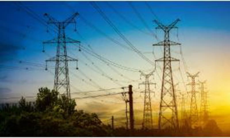 Electrical transformer and power lines bringing electricity to Nigerian communities
