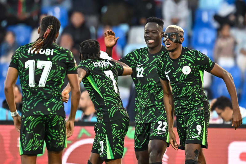 Nigerian footballer Victor Osimhen celebrating a goal during the Africa Cup of Nations quarter-final match against Algeria in Marrakesh stadium