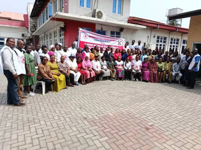 Red Cross volunteers preparing for door-to-door vaccination awareness campaign in Lagos, Nigeria