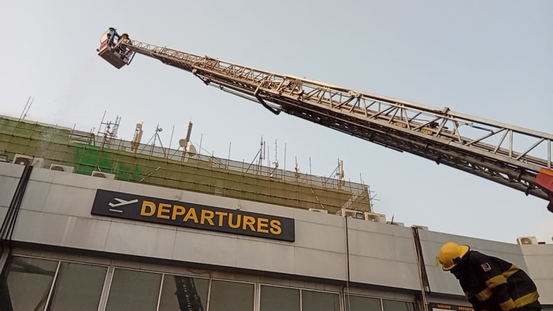 Emergency responders coordinating outside Murtala Muhammed International Airport terminal building in Lagos, Nigeria