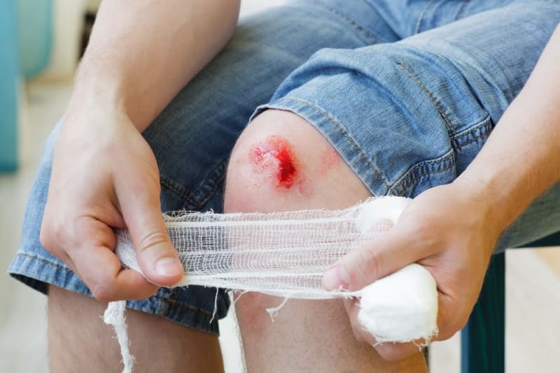 Medical researcher examining chronic wound healing under laboratory conditions