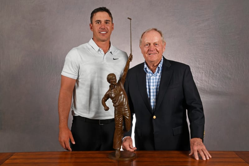 Professional golfer Brooks Koepka competing in PGA Tour tournament wearing cap and polo shirt