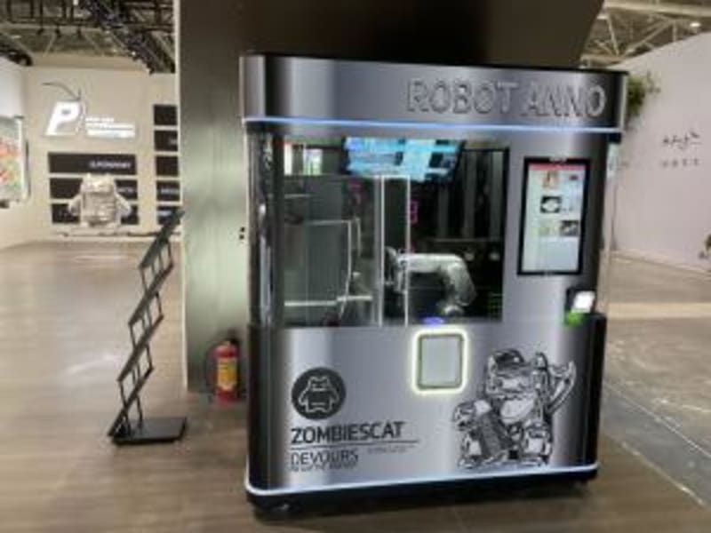 Six-axis robotic arm precisely preparing coffee with latte art in automated kiosk