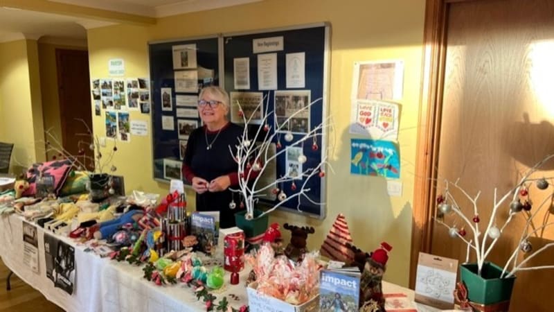 ** Colorful handmade quilts and crafts displayed at charity sale on Isle of Skye, Scotland
