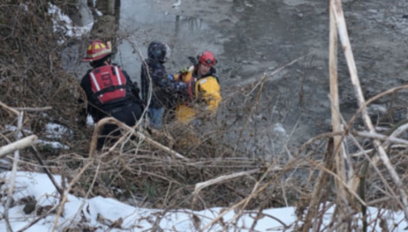 Cincinnati firefighters at Bramble Park ravine during rescue of young girl with autism