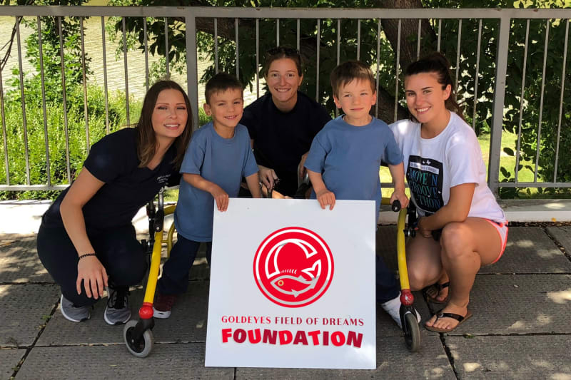 Winnipeg Goldeyes baseball fans cheering at Blue Cross Park during community fundraising event