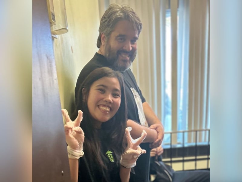 Volunteers serving meals at community mission dining hall helping neighbors in need