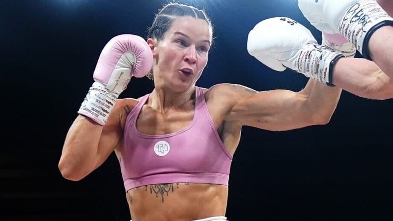 ** WBO lightweight champion Terri Harper in boxing stance wearing championship belt