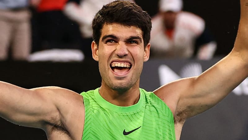 Carlos Alcaraz celebrates victory on court after five-hour Australian Open semifinal match