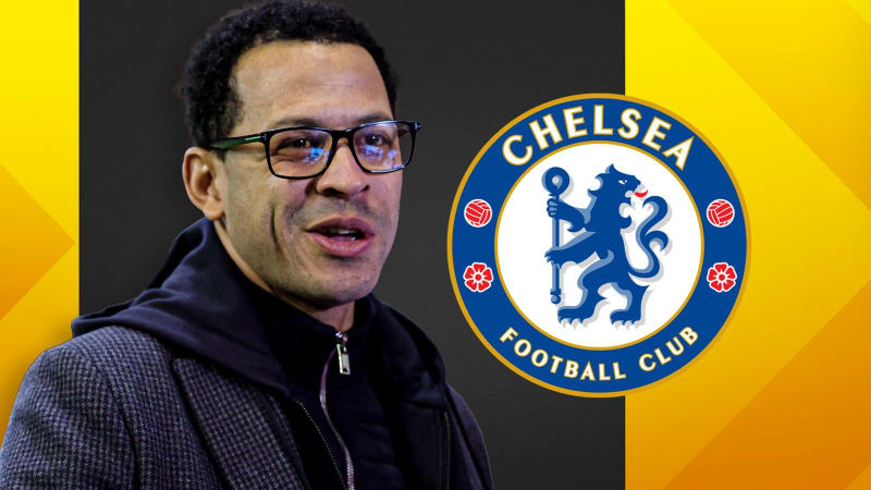 Chelsea Football Club Stamford Bridge stadium exterior on a bright sunny day with blue skies and enthusiastic supporters