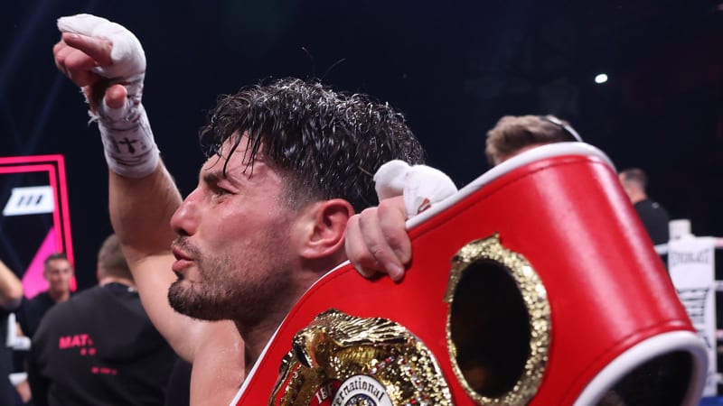 Josh Kelly celebrates with raised arms after winning IBF light-middleweight championship in Newcastle