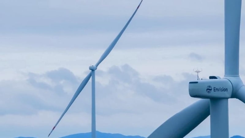 Two-blade wind turbine against blue sky generating renewable energy in test facility