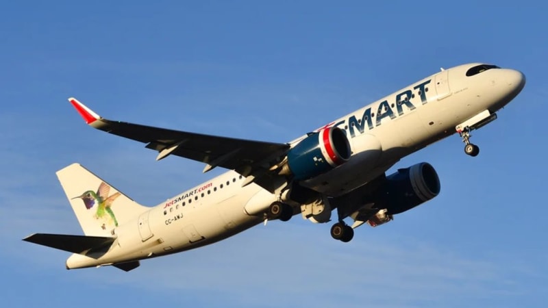 Argentine families with luggage at international airport departure terminal, smiling and ready to travel