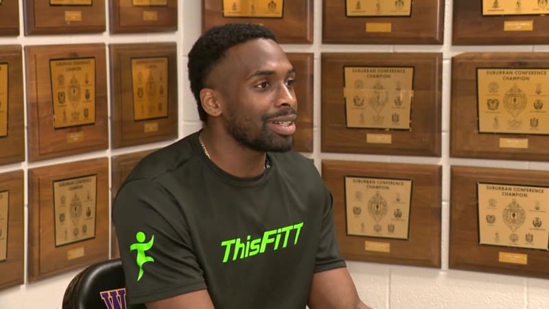 Darius Clark mid-jump showing his record-breaking 51-inch vertical leap at athletic facility