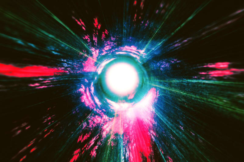 Abstract illustration of a small primordial black hole exploding in space with energy particles