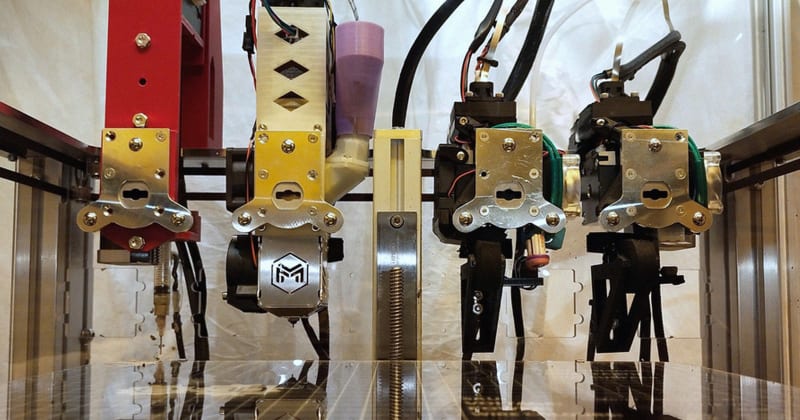 MIT's modified 3D printer with multiple extruders creating working electric motor with moving parts