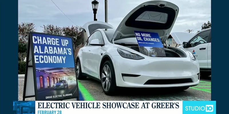 Multiple electric vehicles parked at outdoor community showcase event in downtown Mobile Alabama