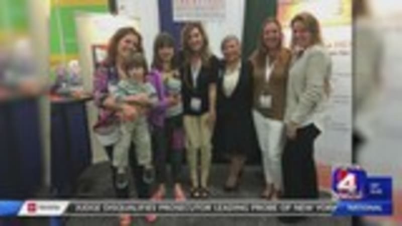 Smiling Wallis family from Bluffdale standing together, representing hope and determination in fighting rare creatine deficiency disease