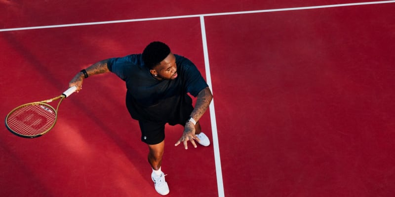 DJ Mustard smiling confidently in athletic wear, showcasing his impressive 125-pound weight loss transformation journey