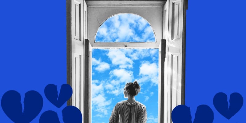 Smiling person standing confidently outdoors in sunshine, representing personal growth and renewal after life transitions