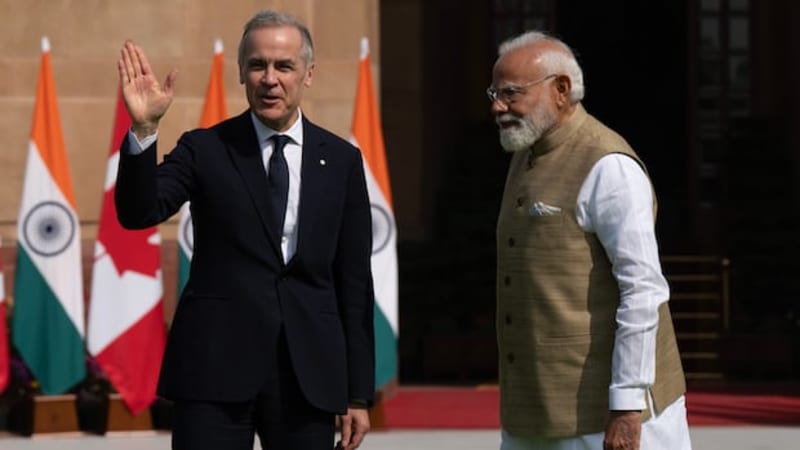 Prime Minister Mark Carney and Indian Prime Minister Narendra Modi shake hands at diplomatic meeting in New Delhi