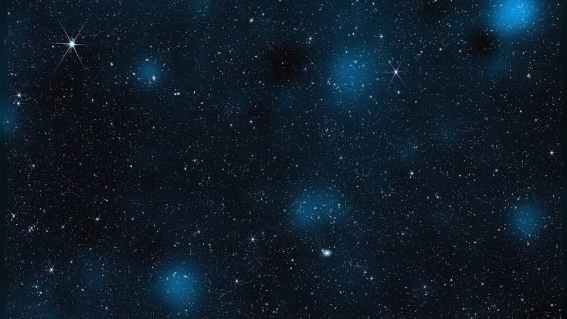Blue overlay showing dark matter concentrations surrounding nearly 800,000 galaxies captured by James Webb Space Telescope