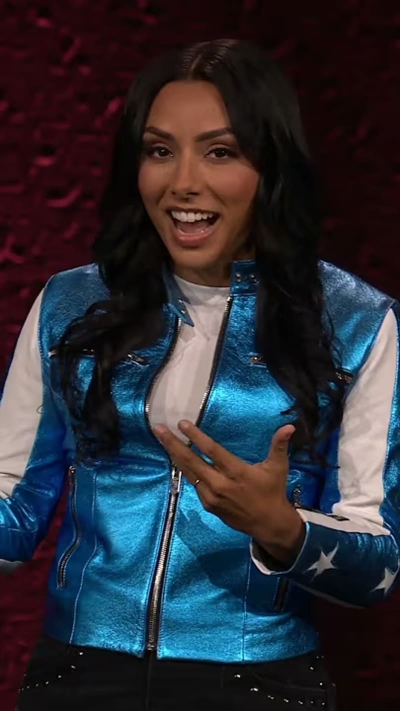 Michelle Khare speaking on TED stage about embracing fear and the amateur's mindset