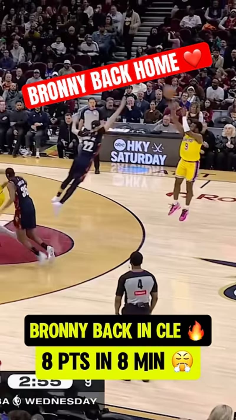 ** Bronny James playing basketball as Cleveland crowd cheers enthusiastically in arena stands