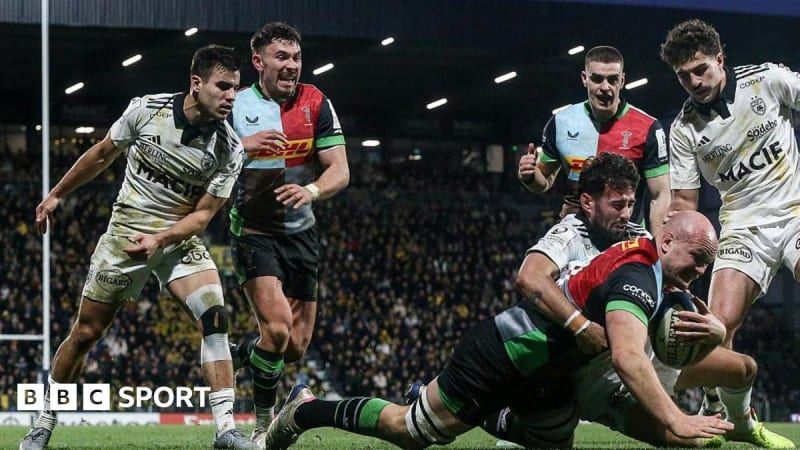 Harlequins rugby players celebrating dramatic victory on field in France during Champions Cup match