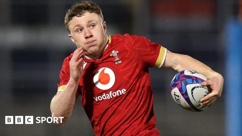 Cardiff wing Tom Bowen celebrating after scoring a try during a rugby match, representing Wales U20's promising talent
