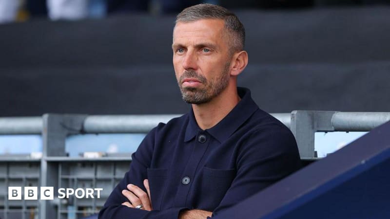 Gary O'Neil looking focused and determined on the sidelines during a football match as team manager