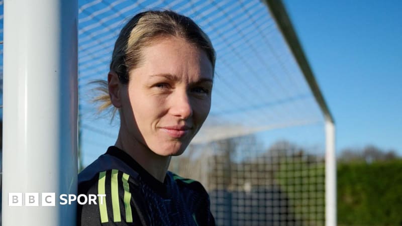Swedish goalkeeper Jennifer Falk wearing Liverpool FC training gear, smiling at the club's facilities after completing her loan move