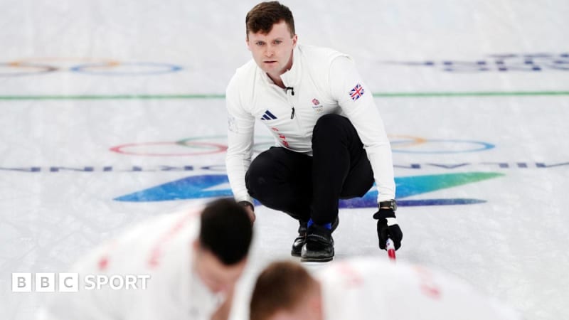 Bruce Mouat throwing curling stone during Team GB's opening match at Cortina Olympics