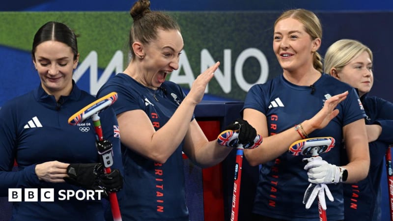 Team GB women's curling team celebrating on ice after defeating Canada at Winter Olympics