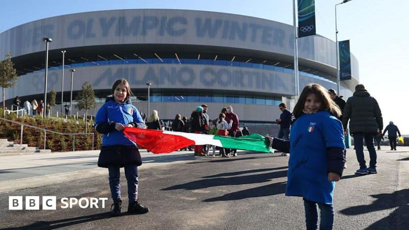 Packed ice hockey arena with players on ice during Italy versus France Olympic match