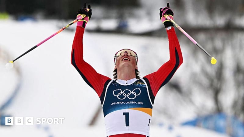 Johannes Hoesflot Klaebo celebrating with Norwegian flag after winning sixth gold medal at Winter Olympics