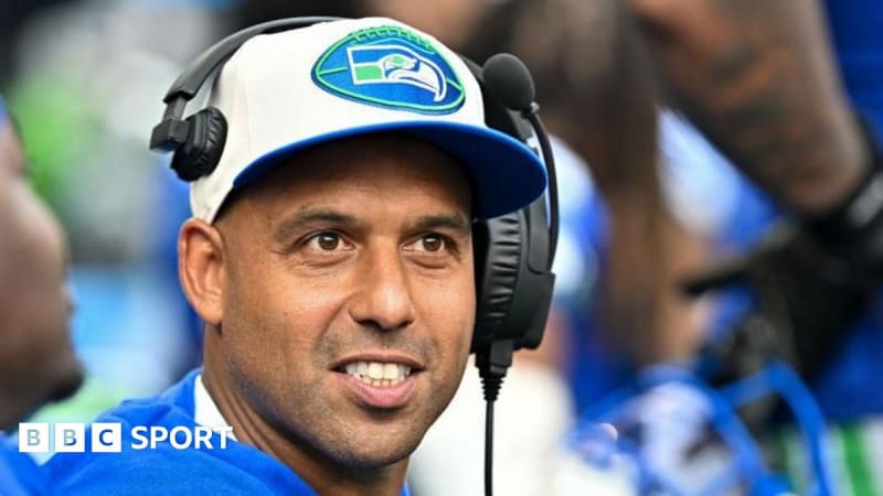 Aden Durde coaching on Seattle Seahawks sideline during NFL playoff game atmosphere