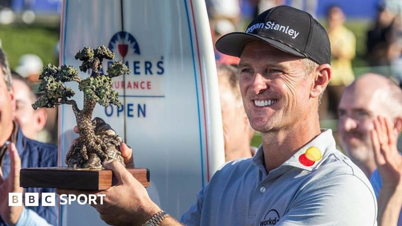 Justin Rose holding trophy after winning Farmers Insurance Open at Torrey Pines golf course