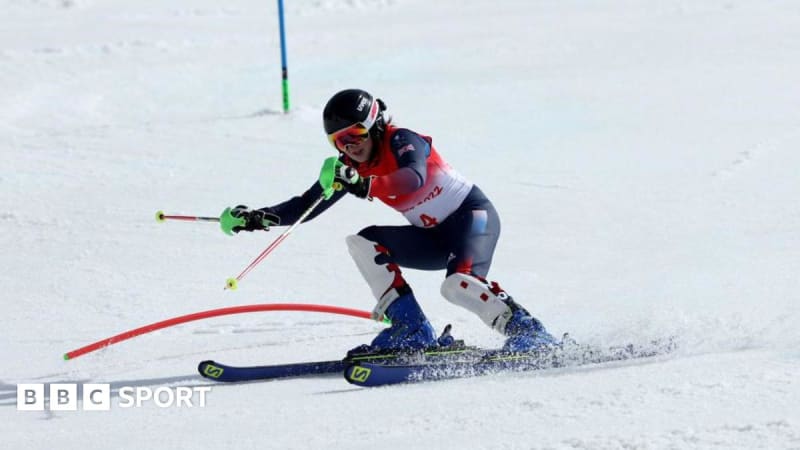Para-alpine skier Menna Fitzpatrick racing downhill with guide during competition
