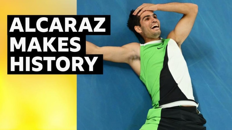 Carlos Alcaraz celebrates winning Australian Open championship trophy on court in Melbourne
