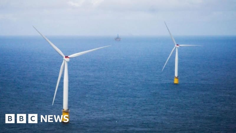 Offshore wind turbines rising from blue ocean waters in the North Sea region