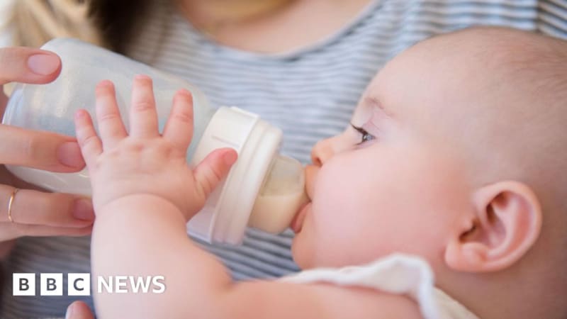 Baby formula containers on shelf showing clear product labeling and batch numbers for parent safety verification