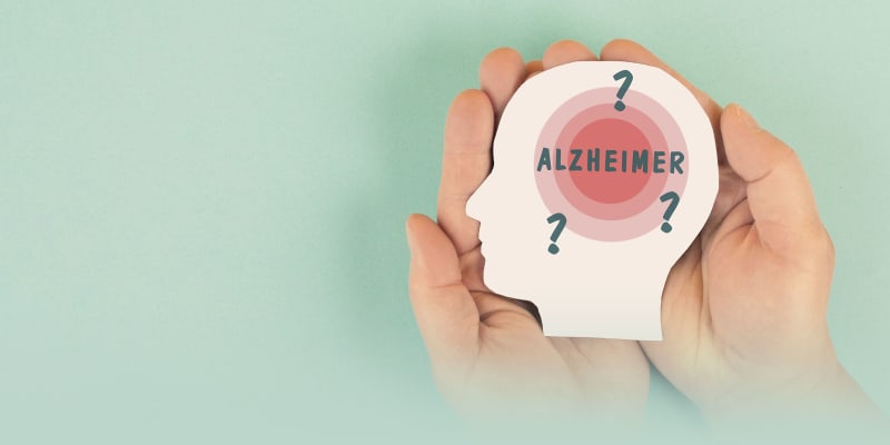 Doctor examining brain scan images on medical monitors in modern hospital setting