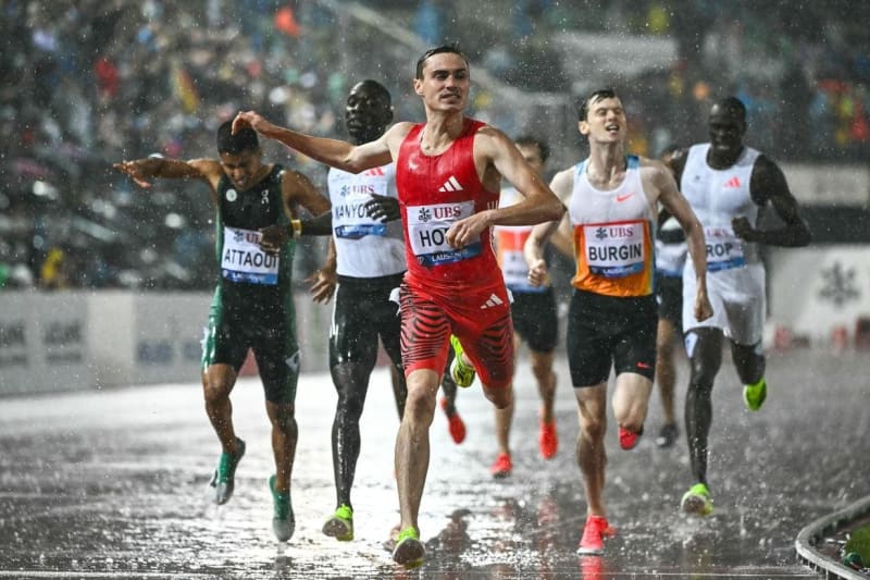 Runner Josh Hoey celebrates after breaking the 800-meter indoor world record in Boston