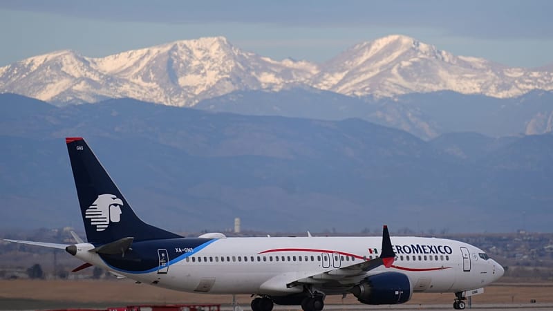 Modern commercial aircraft taking off from airport runway against clear blue sky, representing punctual and reliable air travel excellence worldwide.