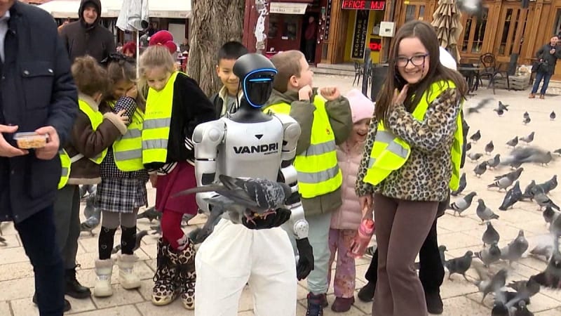 Humanoid robot Roby walks through historic cobblestone streets of Sarajevo's Old Town marketplace