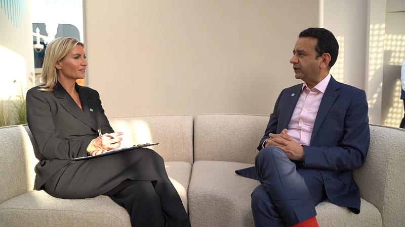 Tech executive speaking at podium during World Governments Summit in Dubai